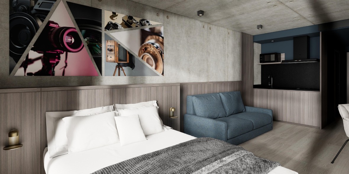 Kamer met 2-persoonsbed en een slaapbank in het Ki Space Hotel